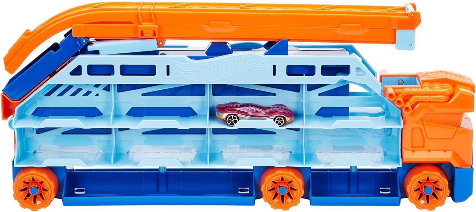 HOT WHEELS City Transporter - mit ausfahrbarer Abfahrtsrampe, Ladefläche für 20 Fahrzeuge und Spezialräder - Geschenk für Kinder ab 4 Jahren, HDY92